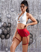 Red ruched high-waisted shorts with chain garter straps and chain hip straps