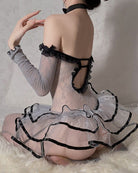 Grey fishnet bodysuit with black lace trim, garter straps, and ruffled tutu skirt