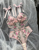 Pink floral embroidered underwire bra and matching sheer brief set with ribbon ties