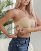 Tan strapless seamless bandeau bra with smooth front and back hook-and-eye closure.