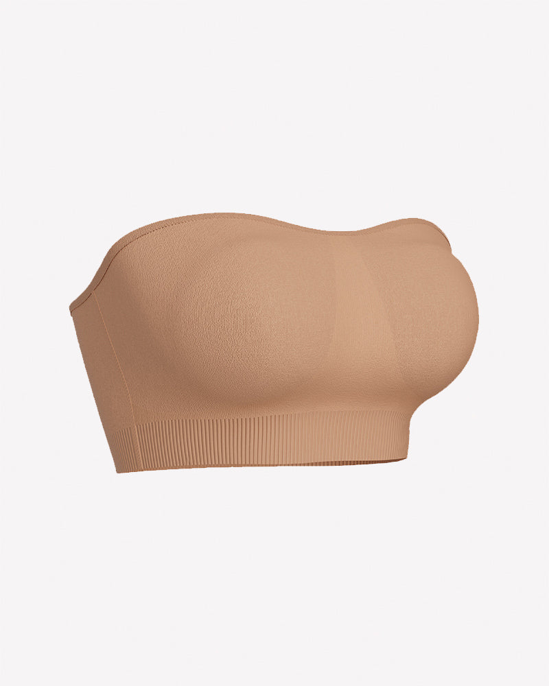 Skin-toned strapless bandeau bra with molded chest pads and ribbed hem