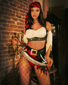 Pirate wench costume set with white peasant top, black corset, fishnet tights, red striped headscarf