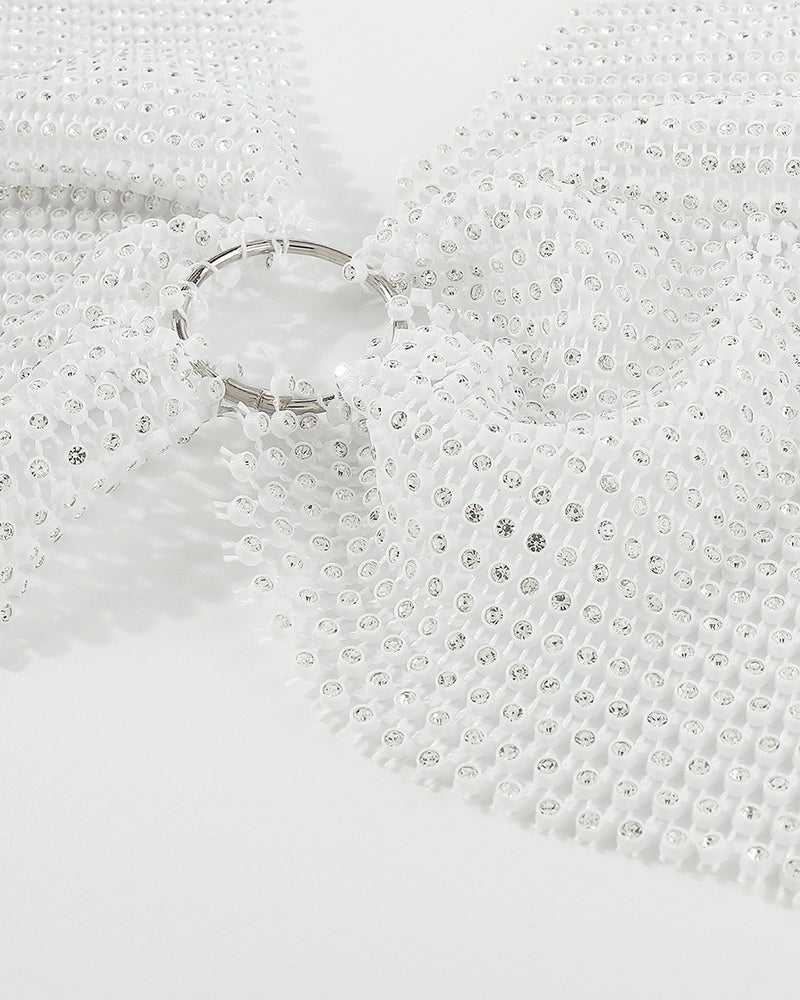 White rhinestone halter crop top with silver O-ring detail