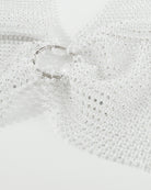 White rhinestone halter crop top with silver O-ring detail