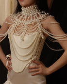 White pearl fringe halter top with layered pearl chains and scalloped bead clusters.