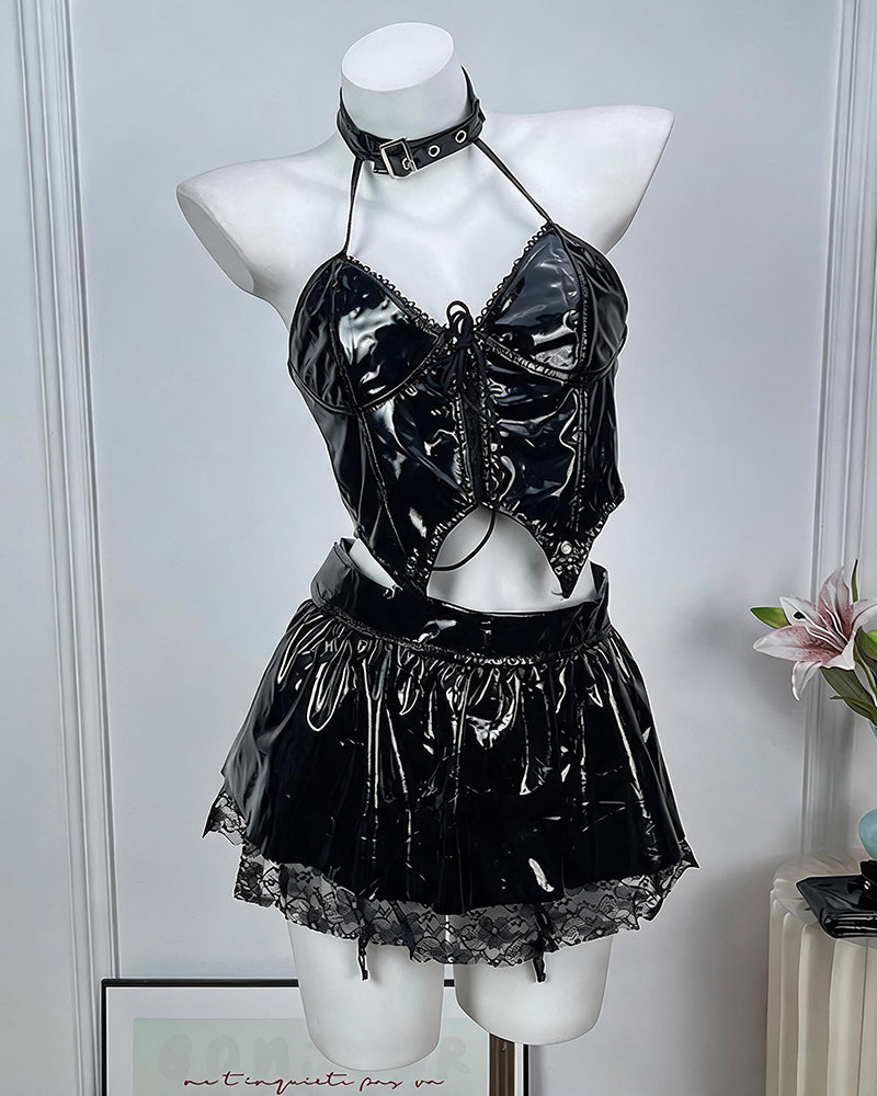 Black leather lingerie set on mannequin: halter crop top, choker, and mini skirt