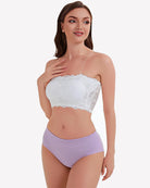 White floral lace strapless bandeau bra on model with scalloped trim