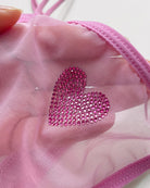 Pink sheer mesh thong with rhinestone heart applique.