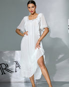 White layered nightgown with ruffled shoulder detailing and knee-length tiered hem