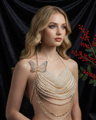 Pearl halter top with layered bead fringe and butterfly pendant, draped chains