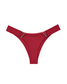 Dark red minimal-coverage thong panties with V-shaped metal accents at the sides