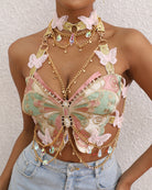 Embroidered butterfly bustier with layered gold chains and pink butterfly appliques