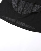 Black sheer fabric close-up showing hem seam and subtle shimmer