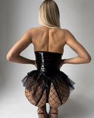 Black halter bodysuit with open back, glossy PU leather band, and mesh skirt panels