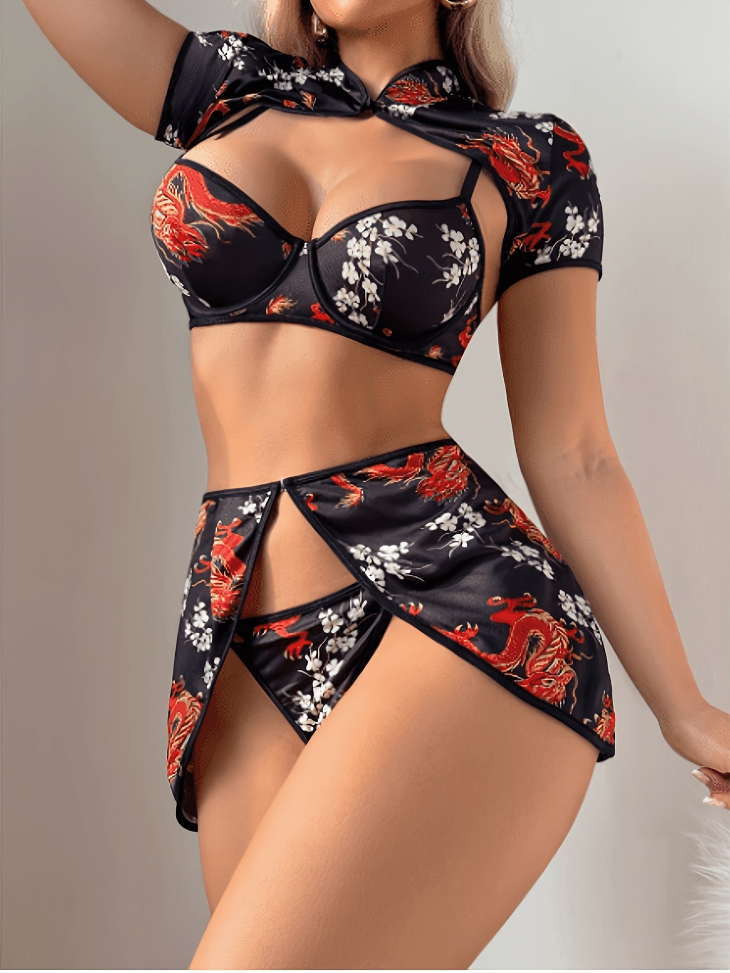 Black lingerie set with underwire bra and thong-style skirt panels, dragon and floral print