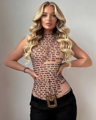 Sheer mesh halter top with all-over lyric text print, nude pink