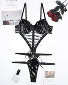 Black patent lace-up corset bodysuit with underwire cups, front lacing, and thong bottom