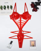 Red PVC patent lace-up corset bodysuit shown flat with underbust cups and harness straps