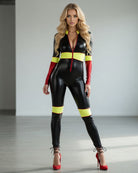 Black PVC racing catsuit with yellow waistband and leg bands, red sleeve cuffs, front view
