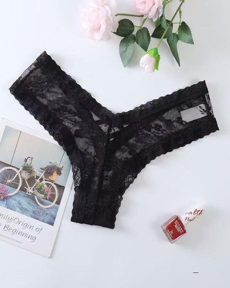 Black lace mesh low-rise thong panties, flat lay with scalloped edges