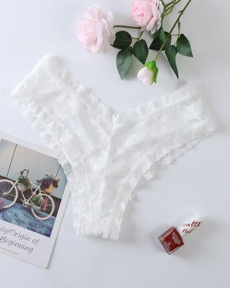 White lace mesh low-rise thong panties, flat lay with soft scalloped lace edges