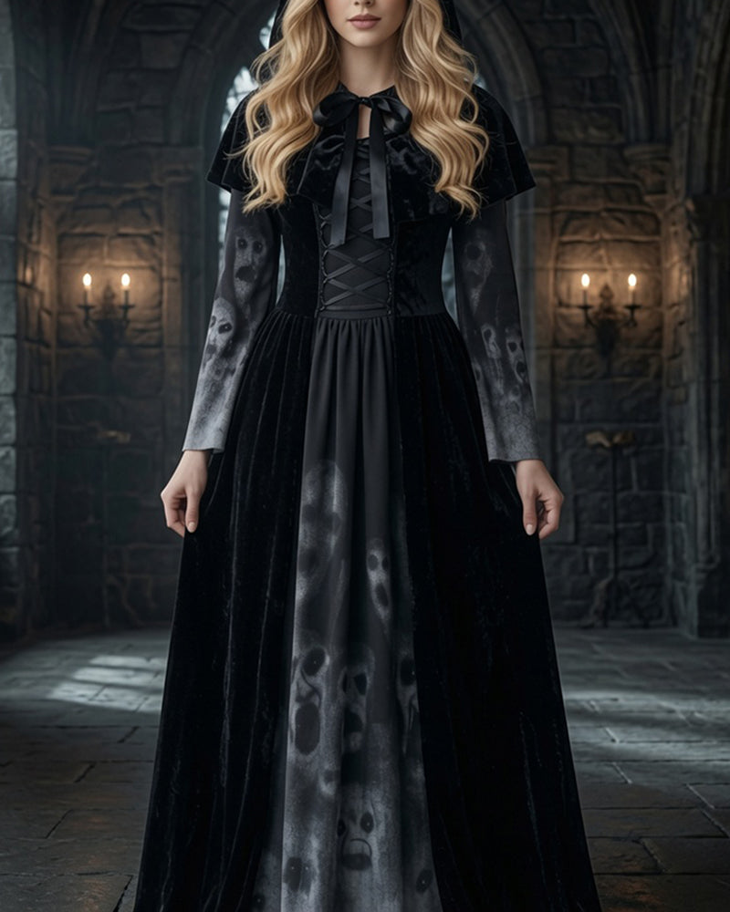 Black maxi dress with tie-neck bodice and skull-print skirt, short cape sleeves