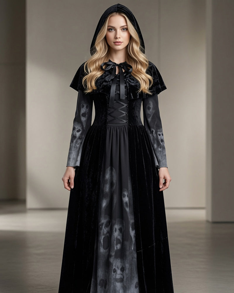 Black long sleeve maxi dress set with skull-print skirt, tie-neck, cape; full front view