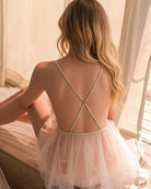 White sheer mesh mini dress with open back and crisscross spaghetti straps