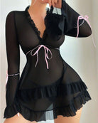 Black sheer mesh chemise with ruffled neckline, long sleeves, and bow trim accents
