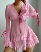 Pink sheer mesh chemise with long sleeves, ruffle neckline, and layered tiered skirt