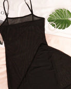 Black sheer mesh lingerie dress close-up, thin straps and long bodycon shape