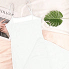 White sheer mesh slip dress with thin spaghetti straps and long bodycon silhouette