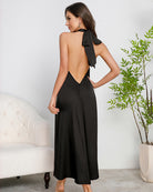 Black satin halter maxi dress, open back with tie bow and V-back