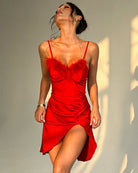 Red satin slip dress with feather trim bust, ruched waist and high thigh slit