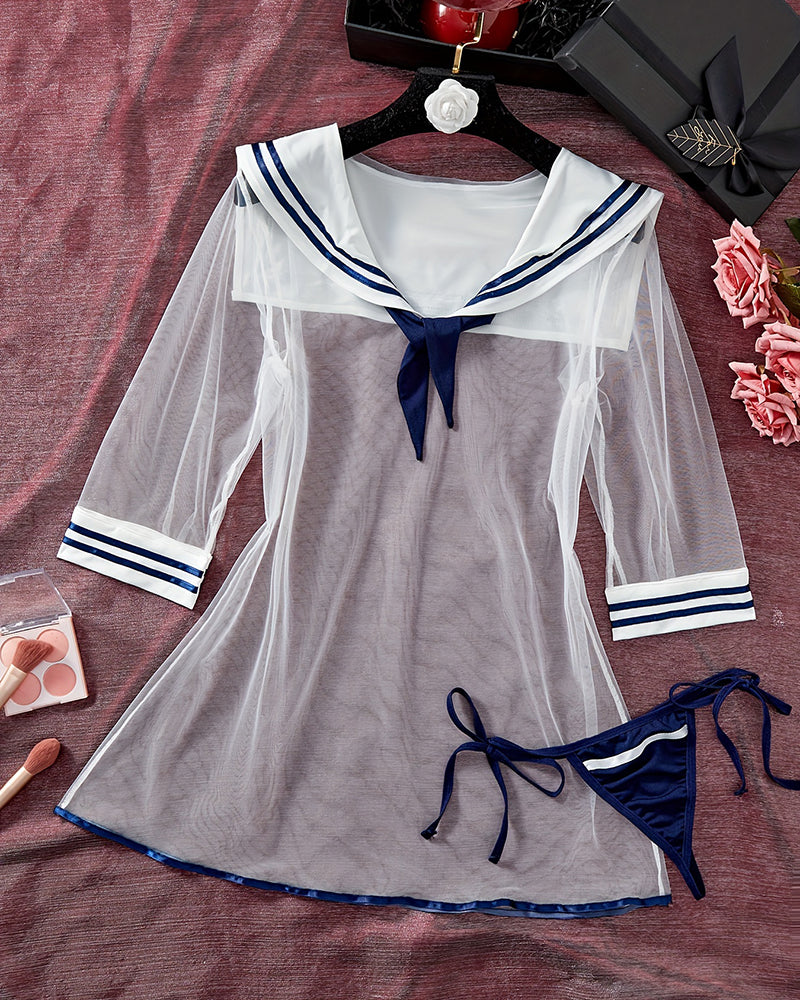 Sheer mesh sailor dress with navy trim and matching tied thong