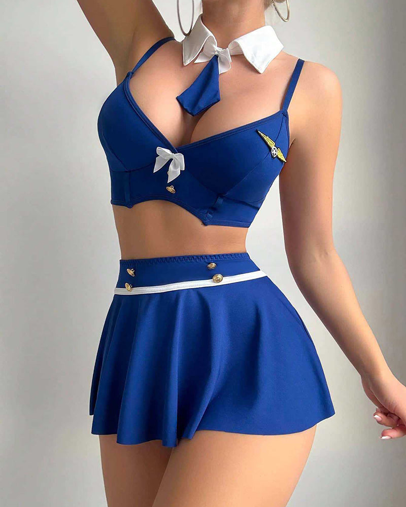 Dark blue pleated mini skirt and matching bra set with white waistband stripe and collar