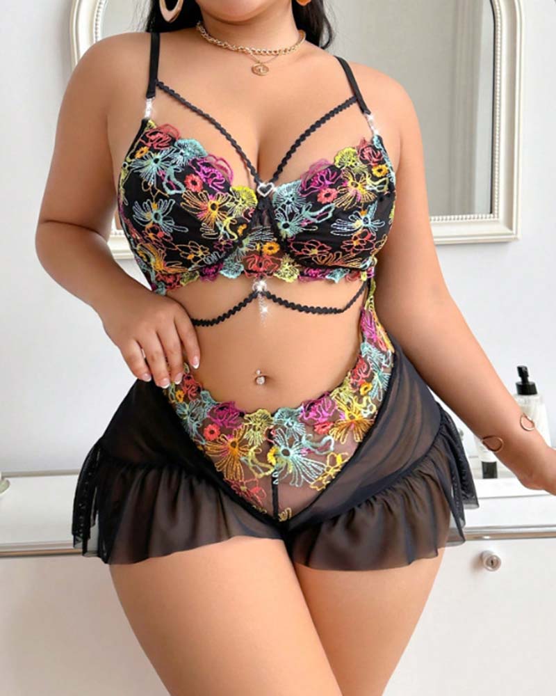 Black floral lace bodysuit with sweetheart bust, embroidered waist, ruffle skirt
