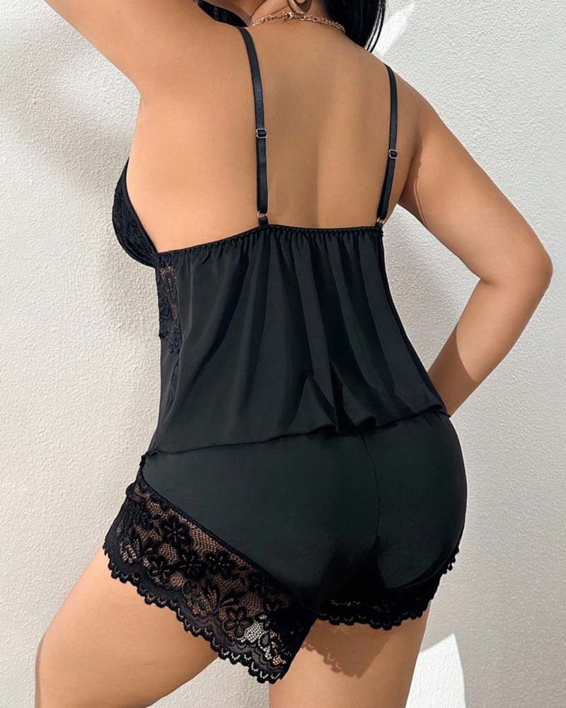 Black lingerie set with spaghetti back straps and lace-trimmed shorts