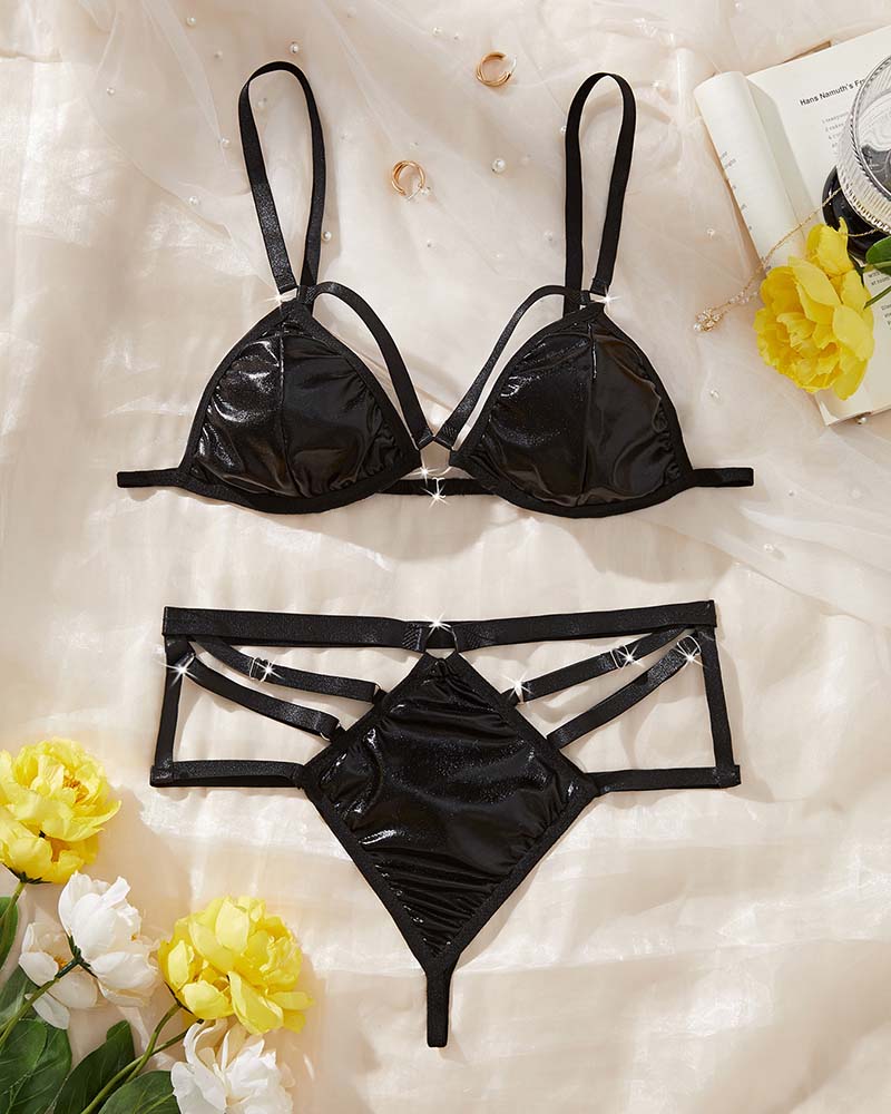 Black lingerie set laid flat: underwire bra with straps and high-waist brief