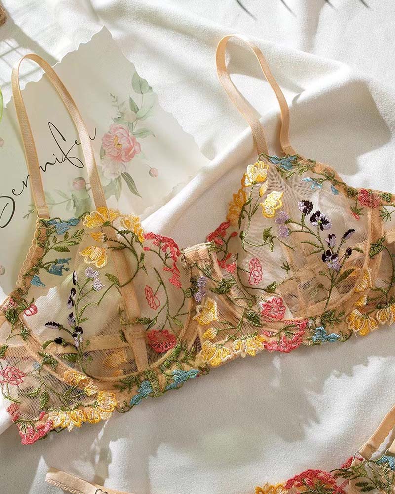 Black floral tie-knot bralette with scalloped lace trim and ruffle straps