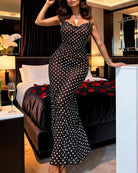 Black polka-dot mini chemise dress with sleeveless deep V and fitted skirt