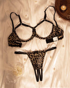 Leopard print lingerie set featuring underwire bralette and thong with black straps