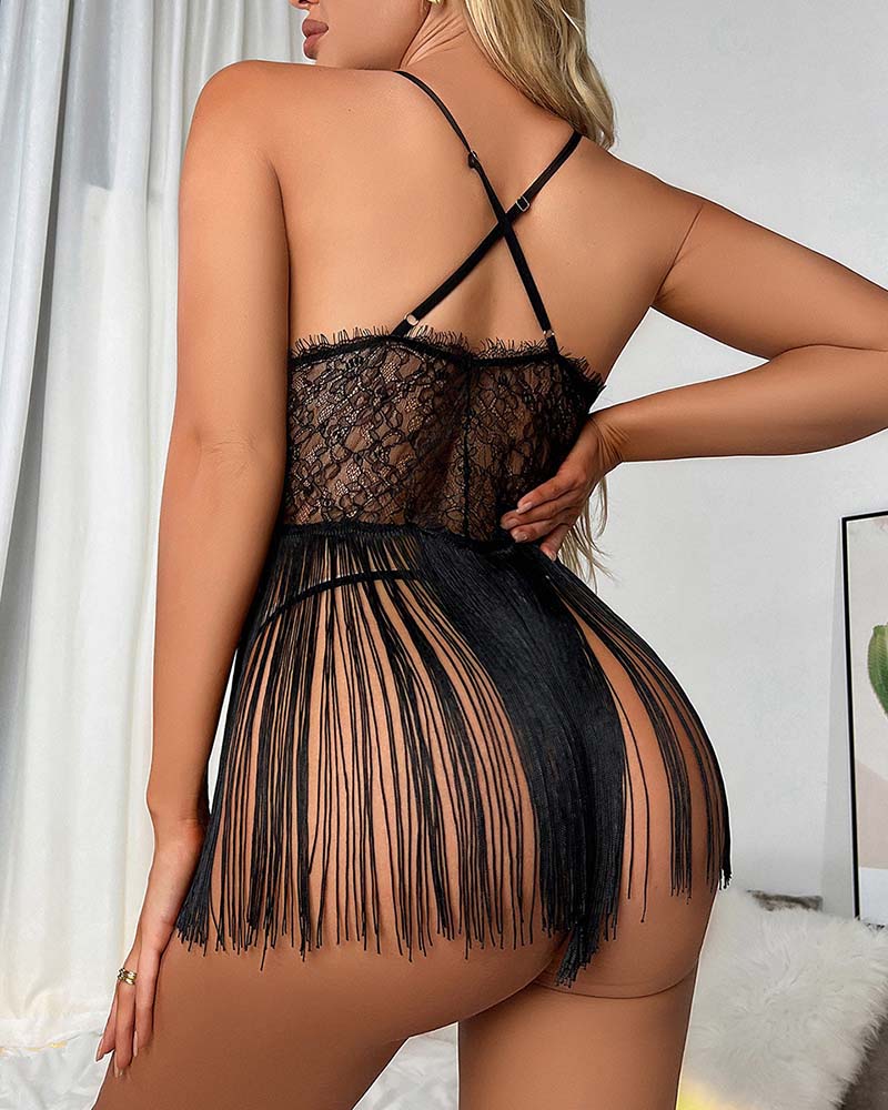 Black floral lace mini dress with crisscross back straps and fringe skirt