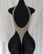 Sheer mesh bodysuit in black with rose print, open back and V-front