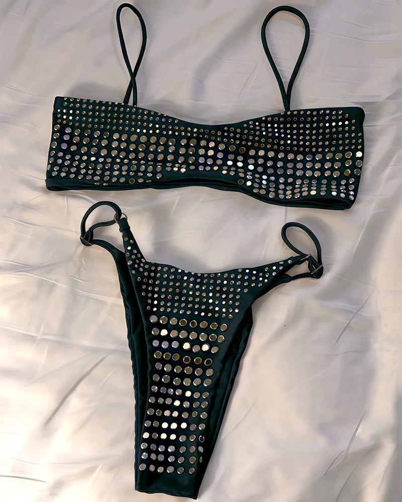 Black rhinestone bandeau bra top and thong with strappy sides, flat lay