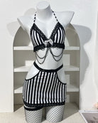 Striped lace-trim bra and mini skirt lingerie set on mannequin, black and white with chains