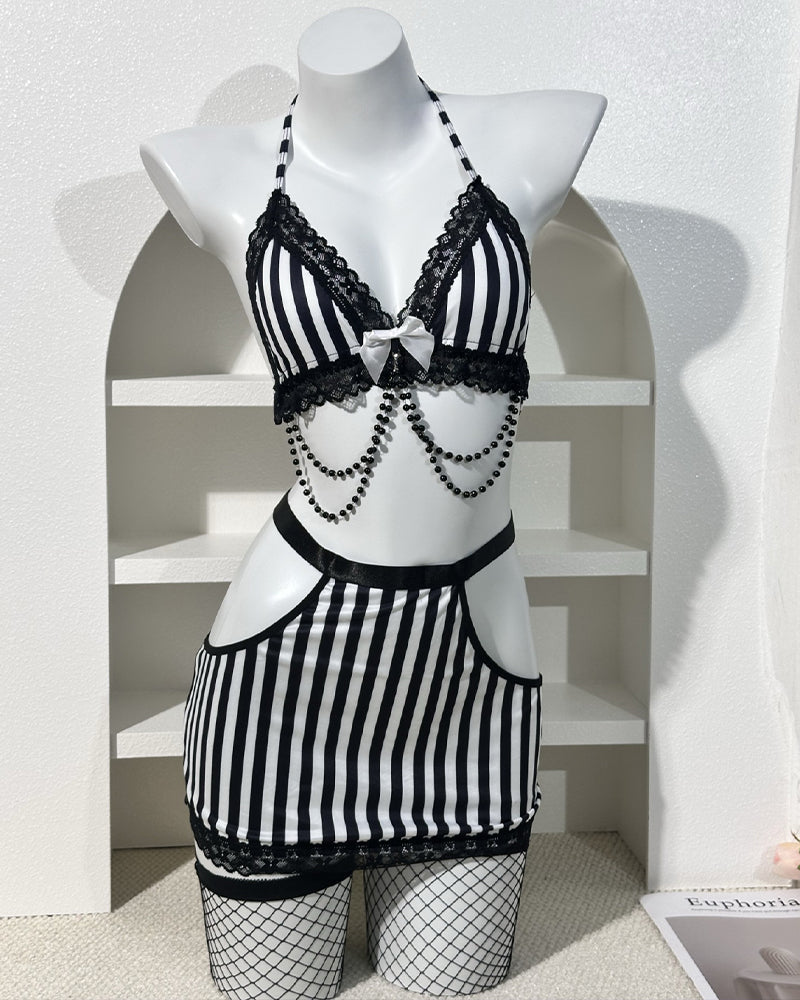 Striped lace-trim bra and mini skirt lingerie set on mannequin, black and white with chains