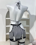 Striped lace-trim lingerie set with tie-back straps, black and white on mannequin