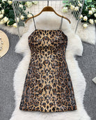 Leopard sequin mini dress on hanger, spaghetti straps, fitted silhouette