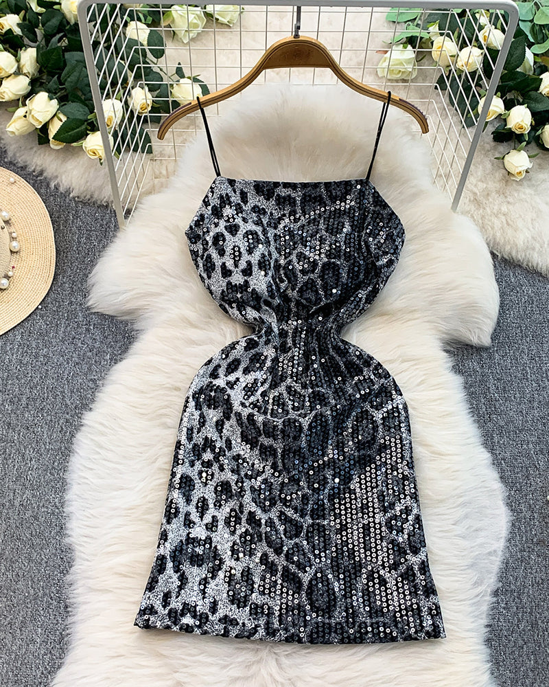 Black leopard sequin mini dress on hanger, spaghetti straps, flared hem